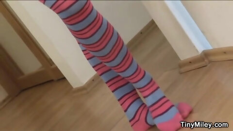 Teen Tiny Miley fingers her pussy